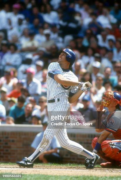 Ryne Sandberg of the Chicago Cubs bats against the Montreal Expos during a Major League Baseball game circa 1992 at Wrigley Field in Chicago,...