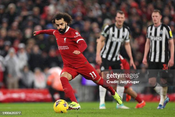 Mohamed Salah of Liverpool takes a penalty during the Premier League match between Liverpool FC and Newcastle United at Anfield on January 01, 2024...
