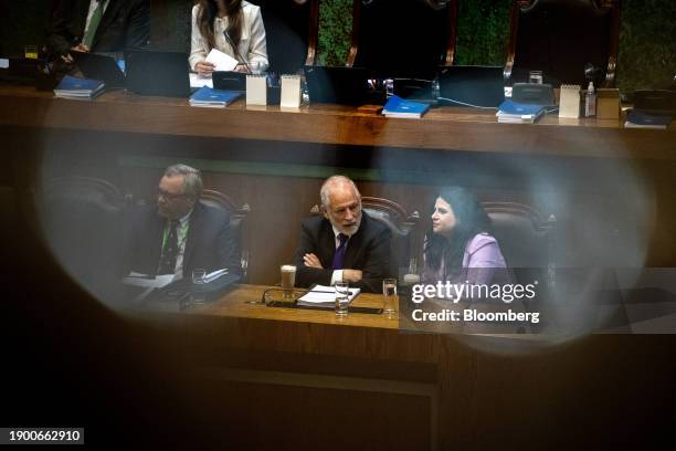 Pablo Ruiz Tagle, lawyer of Carlos Montes, from left, Carlos Montes, Chile's housing minister, and Antonia Orellana, Chile's minister of women and...