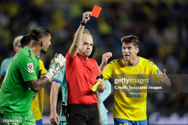 Referee Pablo Gonzalez Fuertes shows the red card to Daley Sinkgraven of UD Las Palmas during the LaLiga EA Sports match between Las Palmas v FC...