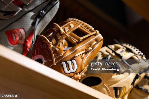 Wilson baseball gloves at the company's flagship store in the SoHo neighborhood of New York, US, on Thursday, Jan. 4, 2024. Amer Sports Inc., the...