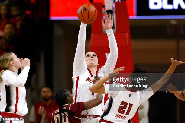 River Baldwin of the NC State Wolfpack blocks a shot by Ta'Niya Latson of the Florida State Seminoles during the first half of the game at Reynolds...