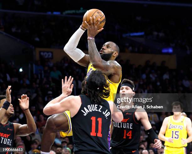 Los Angeles, CA Lakers forward LeBron James, #23, drives to the hoop for a shot over Miami Heat guard Jaime Jaquez Jr., in the firs half at...