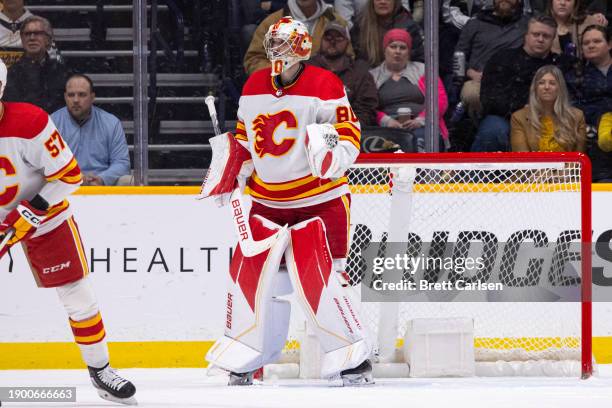 Dan Vladar of the Calgary Flames tends net against the Nashville Predators during the second period at Bridgestone Arena on January 4, 2024 in...