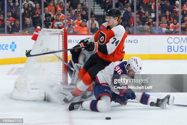 Owen Tippett of the Philadelphia Flyers collides with Jack Roslovic of the Columbus Blue Jackets in overtime at the Wells Fargo Center on January 4,...