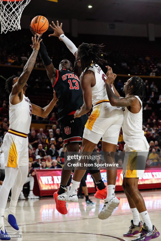 Utah Utes center Keba Keita goes up for.a shot defended by Arizona