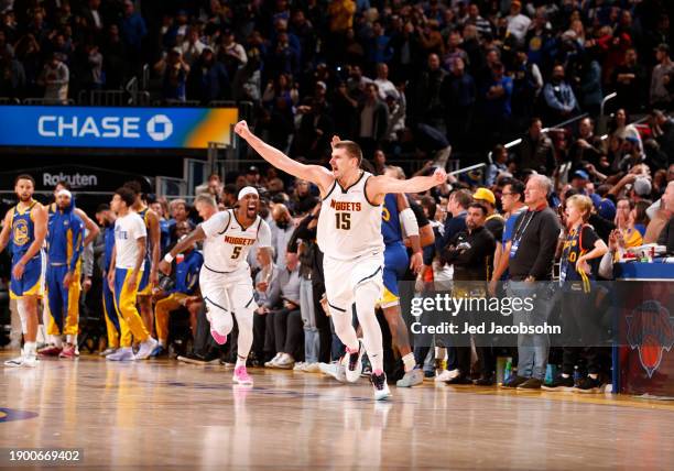 Nikola Jokic of the Denver Nuggets celebrates after making the game winning three point basket against the Golden State Warriors on January 4, 2024...