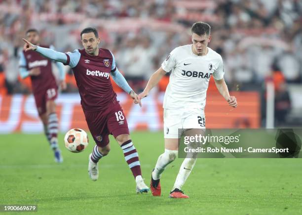 Freiburg's Matthias Ginter and West Ham United's Danny Ings during the Europa League Group A match between West Ham United and SC Freiburg at London...