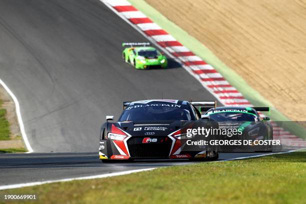 Belgian Enzo Ide and German Christopher Mies compete to win in their Audi R8 during the BlancPain GT series sprint cup main race at the Brands Hatch...