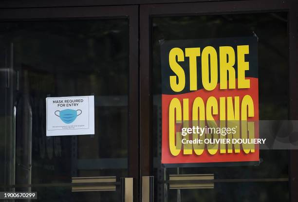 Store displays a sign before closing down permanently as more businesses feel the effects of stay-at-home orders amid the coronavirus pandemic, on...