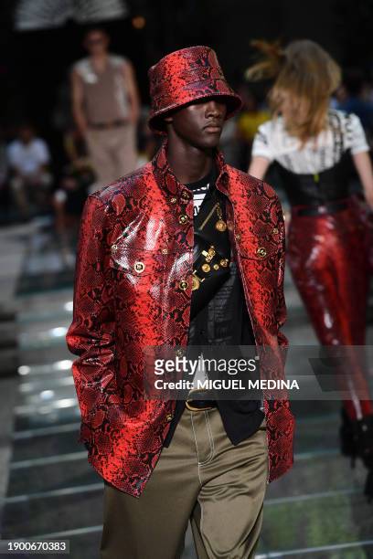 Model presents a creation by Versace during the men's spring/summer 2019 collection fashion show in Milan on June 16, 2018.
