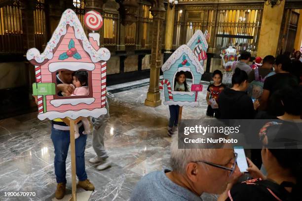 Dozens of girls and boys are taking photos in the facilities of the Postal Palace in the Zocalo of Mexico City, delivering letters to the Three Wise...