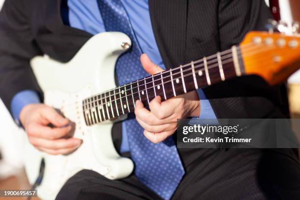 closeup of playing an electric guitar - electric guitarist stock pictures, royalty-free photos & images