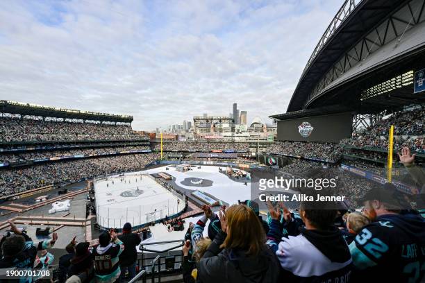 Fans celebrate a goal by Eeli Tolvanen of the Seattle Kraken during the first period against the Vegas Golden Knights at T-Mobile Park on January 01,...