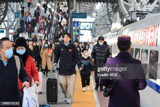 Passengers walk on the platform of Nanjing Railway Station on the last day of New Year's Day holiday on January 1, 2024 in Nanjing, Jiangsu Province...