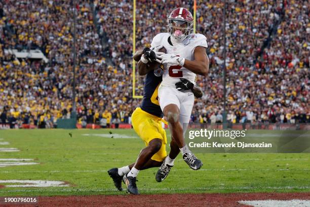 Jase McClellan of the Alabama Crimson Tide scores a touchdown past Mike Sainristil of the Michigan Wolverines in the fourth quarter during the CFP...