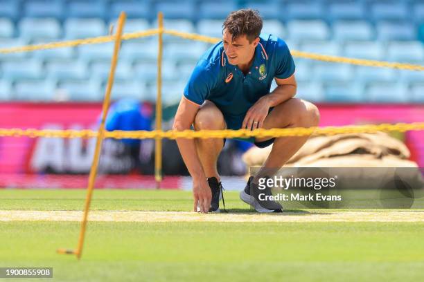 Pat Cummins of Australia inspects the wicket ahead of the Third Test Match between Australia and Pakistan at Sydney Cricket Ground on January 02,...