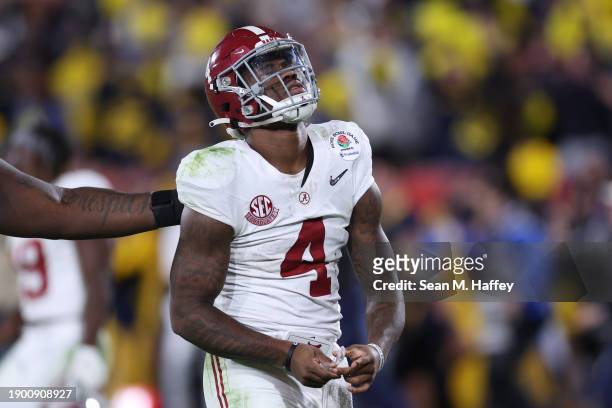 Jalen Milroe of the Alabama Crimson Tide reacts after losing to the Michigan Wolverines 27-20 in overtime during the CFP Semifinal Rose Bowl Game at...