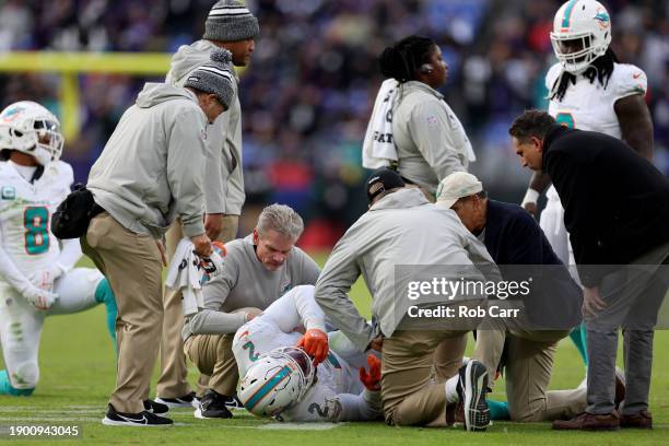 Linebacker Bradley Chubb of the Miami Dolphins is examined on the field after being injured in the fourth quarter against the Baltimore Ravens at M&T...