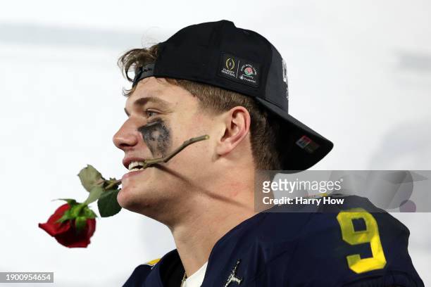 McCarthy of the Michigan Wolverines celebrates after beating the Alabama Crimson Tide 27-20 in overtime to win the CFP Semifinal Rose Bowl Game at...