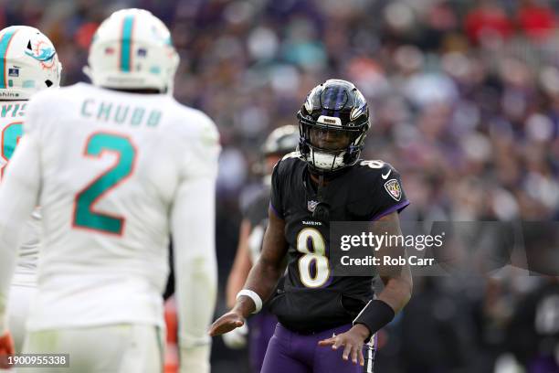 Quarterback Lamar Jackson of the Baltimore Ravens talks with linebacker Bradley Chubb of the Miami Dolphins in the second half at M&T Bank Stadium on...