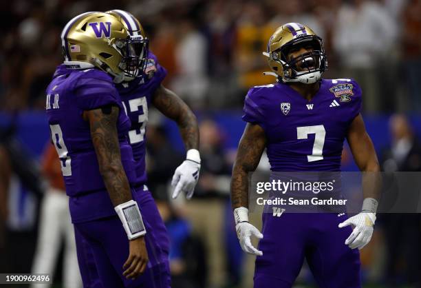 Dillon Johnson of the Washington Huskies celebrates after a touchdown during the first quarter against the Texas Longhorns during the CFP Semifinal...