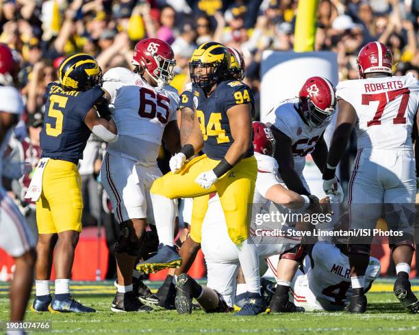 Kris Jenkins of the Michigan Wolverines celebrates a stop during the Rose Bowl during a game between University of Alabama and University of Michigan...