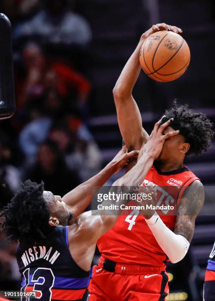 Jalen Green of the Houston Rockets is fouled by James Wiseman of the Detroit Pistons during the second half at Toyota Center on January 01, 2024 in...