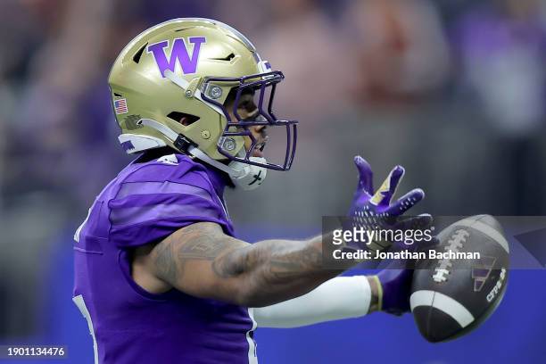 Ja'Lynn Polk of the Washington Huskies celebrates after a touchdown during the second quarter against the Texas Longhorns during the CFP Semifinal...