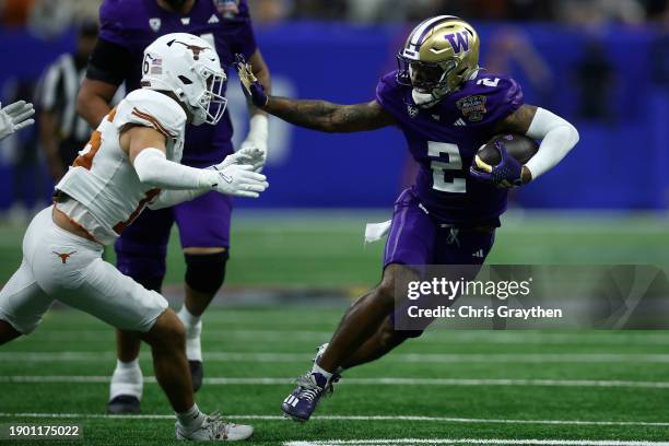 Ja'Lynn Polk of the Washington Huskies runs with the ball during the third quarter against the Texas Longhorns during the CFP Semifinal Allstate...