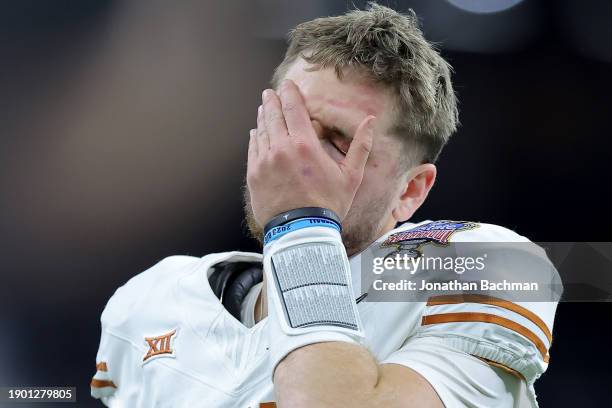 Quinn Ewers of the Texas Longhorns reacts after a fumble during the fourth quarter against the Washington Huskies during the CFP Semifinal Allstate...