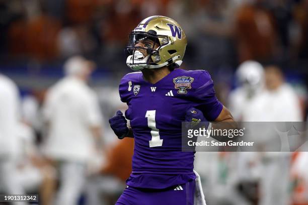 Rome Odunze of the Washington Huskies reacts during the first half against the Texas Longhorns during the CFP Semifinal Allstate Sugar Bowl at...