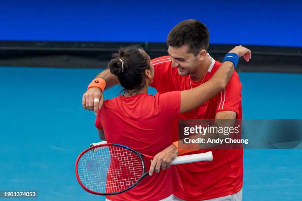 Tomas Barrios Vera and Daniela Seguel of Team Chile celebrate winning match point in the Group B doubles match against Maria Sakkari and Stefanos...