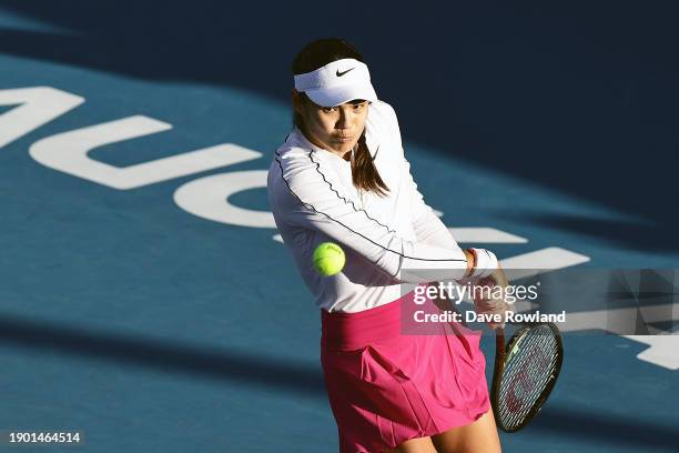 Emma Raducanu of Great Britain plays a shot in her match against Elena-Gabriela Ruse of Romania during the 2024 Women's ASB Classic at ASB Tennis...