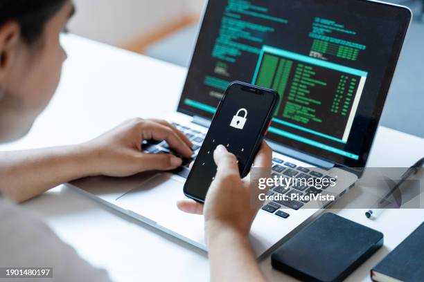 cyber security concept. young woman using mobile phone with padlock on screen. - data privacy stock pictures, royalty-free photos & images
