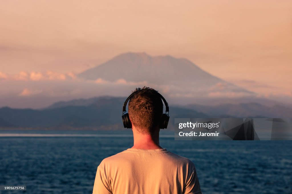Rear view of man with headphones