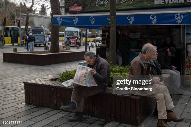Resident reads a newspaper near the ferry terminal in the Uskudar district of Istanbul, Turkey, on Thursday, Jan. 4, 2024. The lira is headed for its...