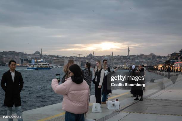 Shoppers and pedestrians along the banks of the Bosphorus strait, by Galataport in the Karakoy district of Istanbul, Turkey, on Thursday, Jan. 4,...