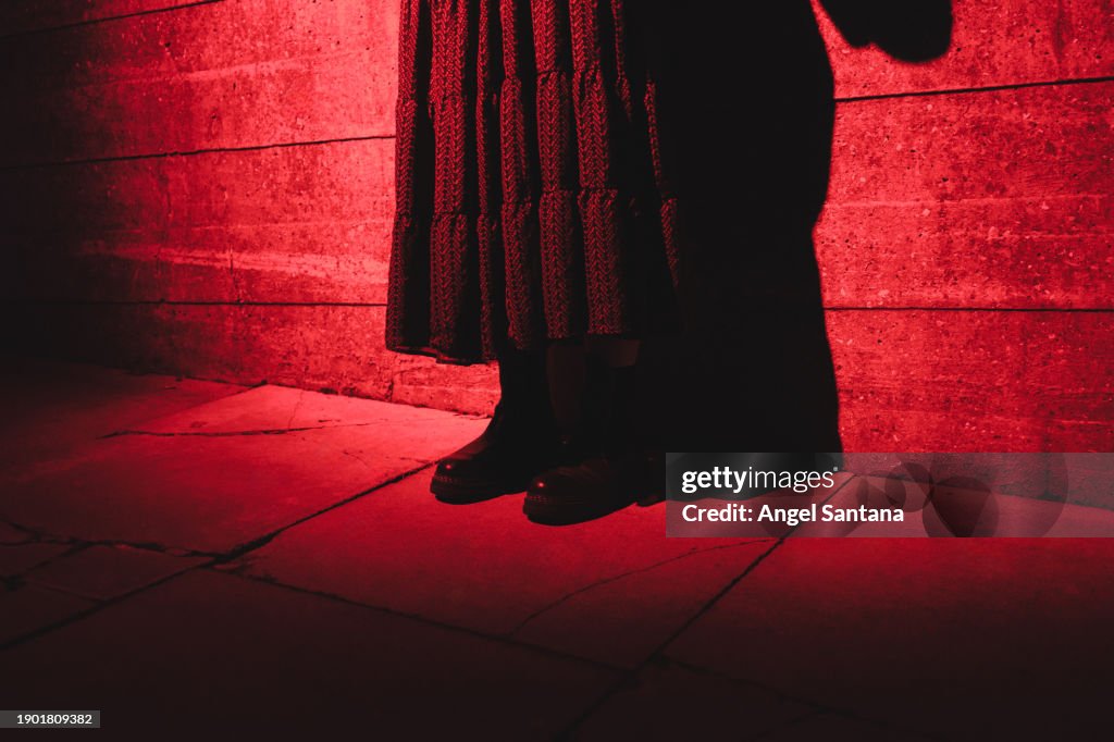Sinister Red Light on a Shadowy Figure
