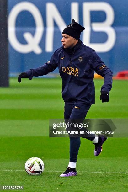 Kylian Mbappe runs with the ball during a Paris Saint-Germain training session at Camous PSG on January 02, 2024 in Paris, France.