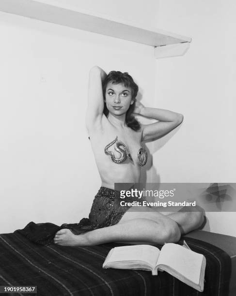 British actress Elizabeth Seal posing in a stage costume with snake bra, April 12th 1957. She is playing the role of Esmeralda in the Tennessee...