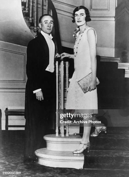 American comedian and actor Joseph Coyne, wearing a tailcoat over a white shirt and bow tie, and British socialite and heiress Edwina Mountbatten,...