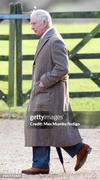 King Charles III attends the New Year's Eve Mattins service at the Church of St Mary Magdalene on the Sandringham estate on December 31, 2023 in...