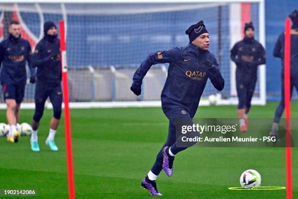 Kylian Mbappe warms up during a Paris Saint-Germain training session at Campus PSG on January 02, 2024 in Paris, France.