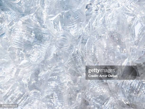 composition of a group of recycled plastic bottles of pvc. - circulaire economie stockfoto's en -beelden