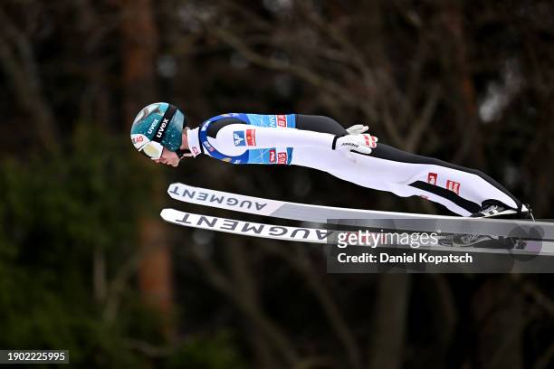 Michael Hayboeck of Austria jumps in the trial run during the FIS World Cup Ski Jumping Four Hills Tournament Men Innsbruck Individual HS128 on...