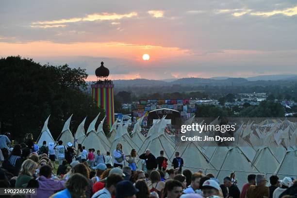 Festival goers gather to watch the sunset above the Park on day 1 of Glastonbury Festival 2023 at Worthy Farm, Pilton on June 21, 2023 in...