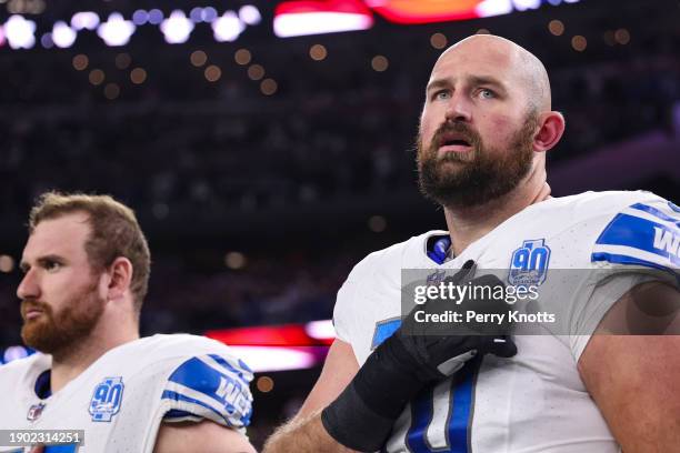 Dan Skipper of the Detroit Lions looks on from the sideline during the national anthem prior to an NFL football game against the Dallas Cowboys at...