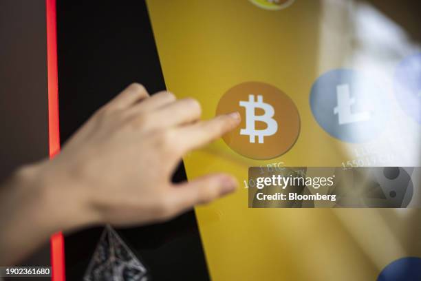 Btcoin logo on a cryptocurrency automated teller machine inside the venue of the Paralelni Polis project, an organization combining art, social...