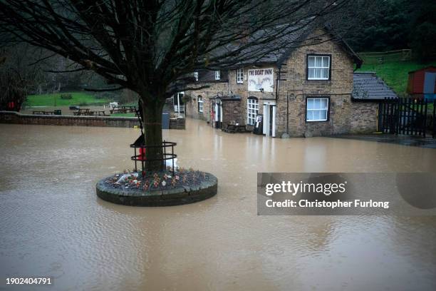 The Boat Inn pub at Jackfield begins to flood on January 02, 2024 in Ironbridge, England. The Met Office issued warnings for wind and rain in parts...